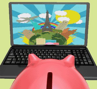 piggy bank looking at laptop with travel destinations